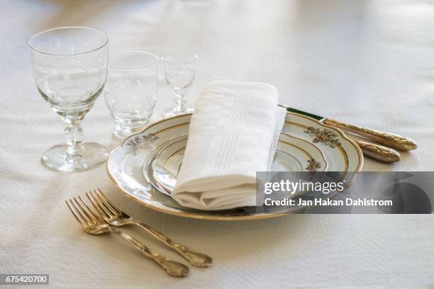 place setting with plates, glasses, forks and knifes - table setting design scandinavian imagens e fotografias de stock