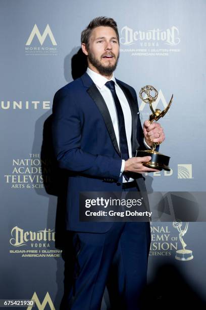 Actor Scott Clifton displays his Emmy Award at the 44th Annual Daytime Emmy Awards at Pasadena Civic Auditorium on April 30, 2017 in Pasadena,...