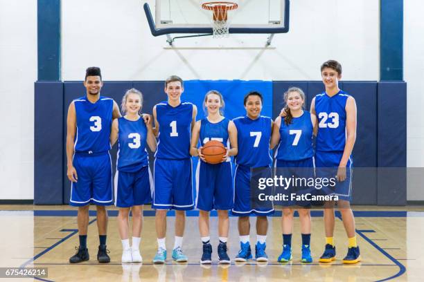 mixed gender high school basketball team posing - african american girl wearing a white shirt stock pictures, royalty-free photos & images