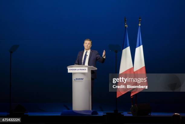 Nicolas Dupont-Aignan, a member of the National Assembly of France, speaks during a campaign event with Marine Le Pen, France's presidential...