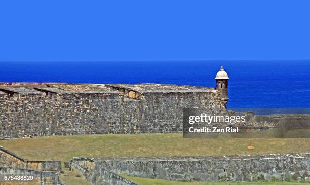 fort san cristobal (castillo san cristobal) and sentry box (garitas) against the caribbean sea - old san juan, puerto rico - old san juan wall stock pictures, royalty-free photos & images