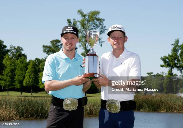 Jonas Blixt of Sweden and Cameron Smith of Australia pose with the trophy after winning in a sudden-death playoff during a continuation of the final...
