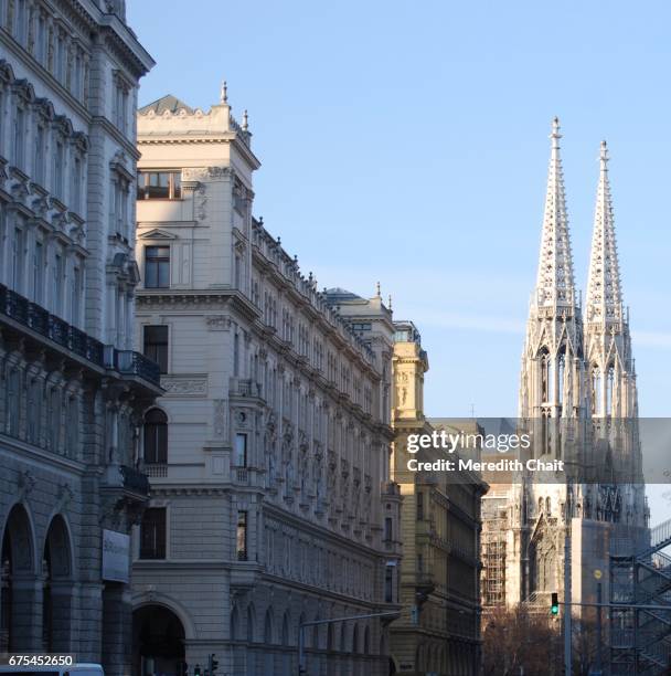 votivkirche through the street - リングストラッセ ストックフォトと画像