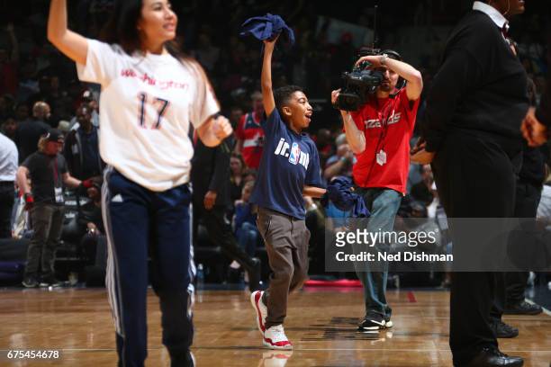Actor, Miles Brown gets the crowd into Game Five of the Eastern Conference Quarterfinals between the Atlanta Hawks and the Washington Wizards during...