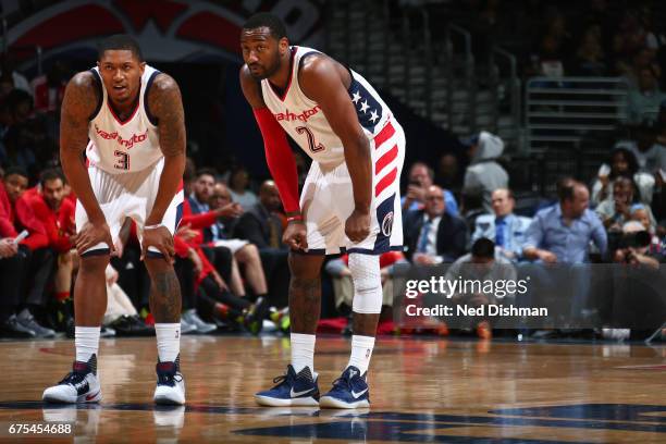 Bradley Beal and John Wall of the Washington Wizards stand on the court during Game Five of the Eastern Conference Quarterfinals against the Atlanta...