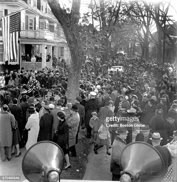 Throngs of people gather in front of 83 Beals St. In Brookline, MA, the house where President John F. Kennedy was born May 29 on the day after the...