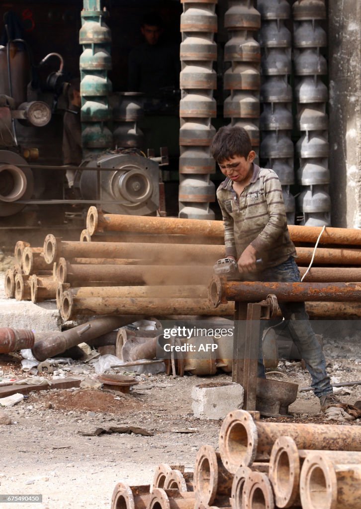 TOPSHOT-SYRIA-CONFLICT-MAY DAY