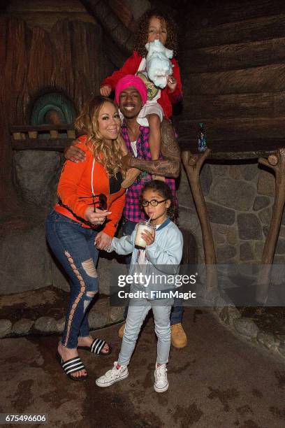 Mariah Carey, Nick Cannon, Moroccan Cannon, and Monroe Cannon prepare to ride on Splash Mountain at Disneyland on April 30, 2017 in Anaheim,...