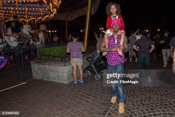 Nick Cannon and Moroccan Cannon visit Disneyland on April 30, 2017 in Anaheim, California.