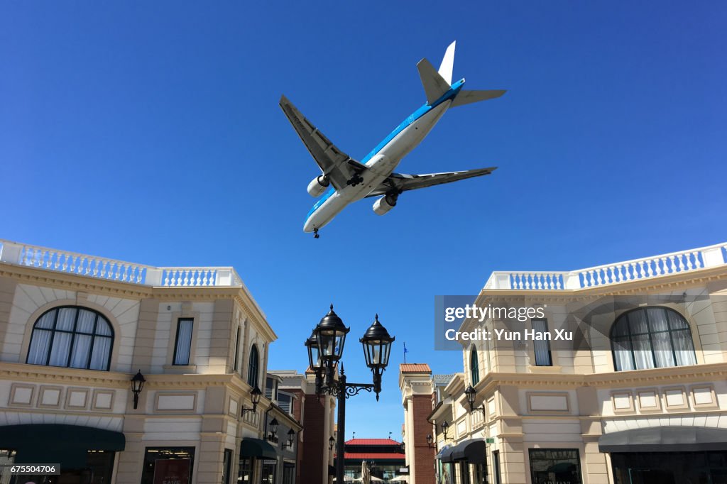 Airplane Flying over McArthurGlen Designer Outlets