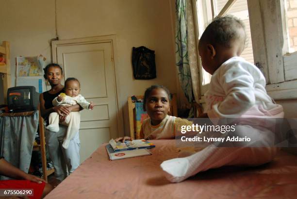 Kenia Moravelo plays with other kids and workers at the shelter where she has been staying since released from her most recent stay in the hospital,...