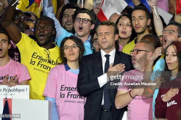 French Presidential Candidate Emmanuel Macron addresses voters during a political meeting at Grande Halle de La Villette on May 1, 2017 in Paris,...