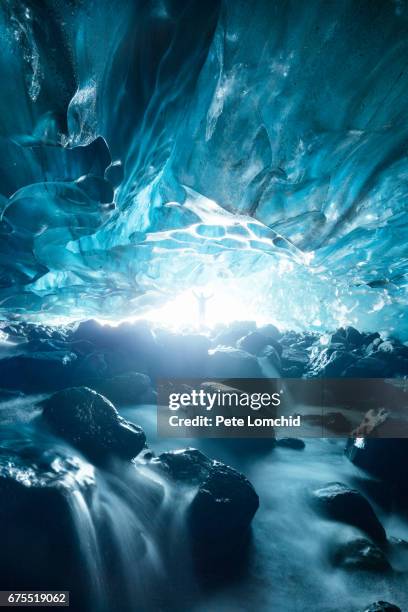 exploration of ice cave in iceland - crystal caves stock pictures, royalty-free photos & images