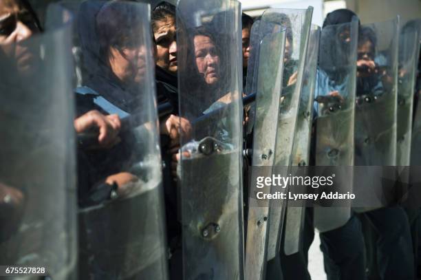 Female police trainees practice with riot gear during their course at the Police Academy in Kabul, Afghanistan, June 2013. The United States has...