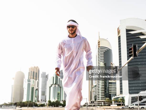man walking in doha - qatar business stock pictures, royalty-free photos & images