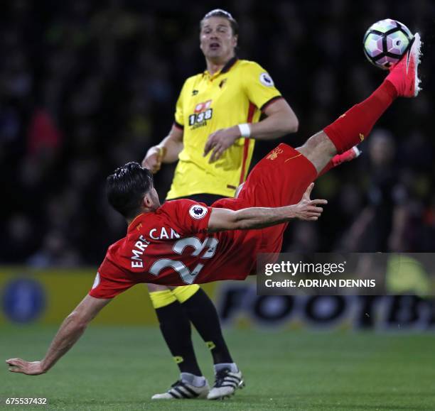 Liverpool's German midfielder Emre Can connects with this overhead kick to open the scoring in the English Premier League football match between...