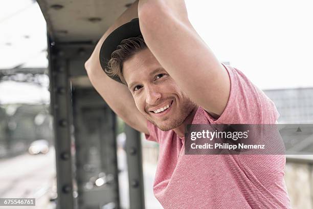 portrait of guy leaning on citybridge - philipp nemenz foto e immagini stock