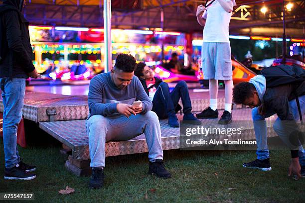 group of teenage boys at fairground - unfilteredtrend stock pictures, royalty-free photos & images