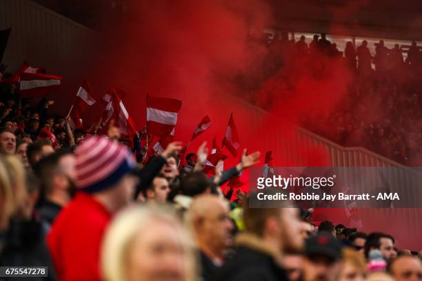 Middlesbrough fans let of flares during the Premier League match between Middlesbrough and Sunderland at Riverside Stadium on April 26, 2017 in...