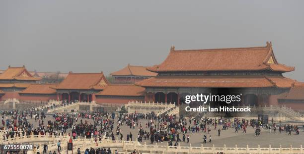 Tourists are seen waking through the grounds at the Forbidden City on April 3, 2017 in Beijing, China