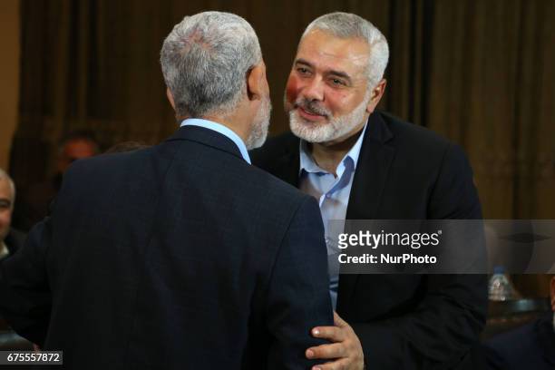 Hamas leader Ismail Haniyeh kisses Hamas Gaza Chief Yehya Al-Sinwar during a ceremony announcing a new policy document, in Gaza City May 1, 2017.