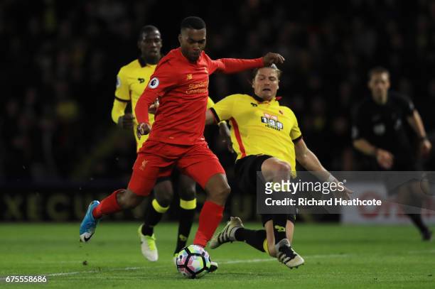 Daniel Sturridge of Liverpool takes a shot on goal under pressure from Sebastian Prodl of Watford during the Premier League match between Watford and...