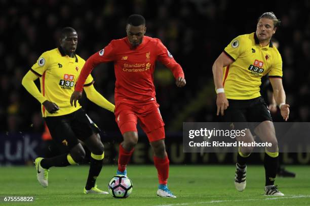 Daniel Sturridge of Liverpool ispursued by Abdoulaye Doucoure and Sebastian Prodl of Watford during the Premier League match between Watford and...