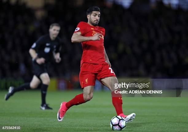 Liverpool's German midfielder Emre Can runs with the ball during the English Premier League football match between Watford and Liverpool at Vicarage...