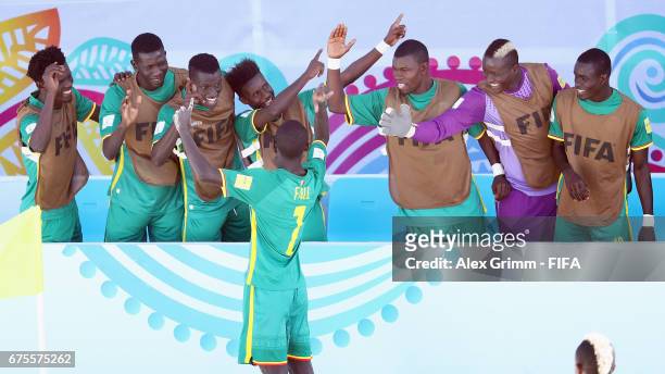 Babacar Fall of Senegal celebrates a goal with team mates during the FIFA Beach Soccer World Cup Bahamas 2017 group A match between Switzerland and...