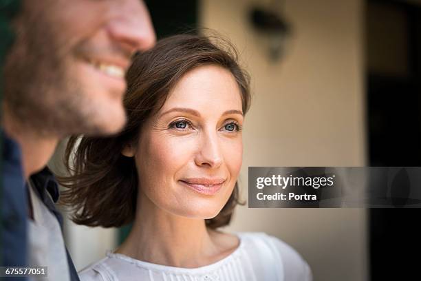 close-up of smiling woman with man - 35 female outdoors stock pictures, royalty-free photos & images