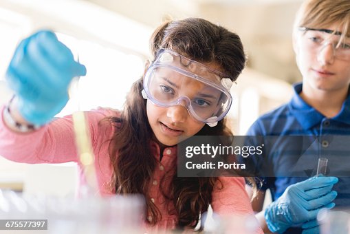 Students Doing Scientific Experiment In Classroom High-Res Stock Photo ...