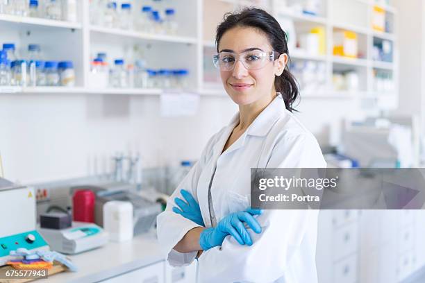 portrait of confident chemist at laboratory - safety glasses stock pictures, royalty-free photos & images