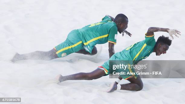 Papa Ndour of Senegal celebrates a goal with team mate Hamad Diouf during the FIFA Beach Soccer World Cup Bahamas 2017 group A match between...