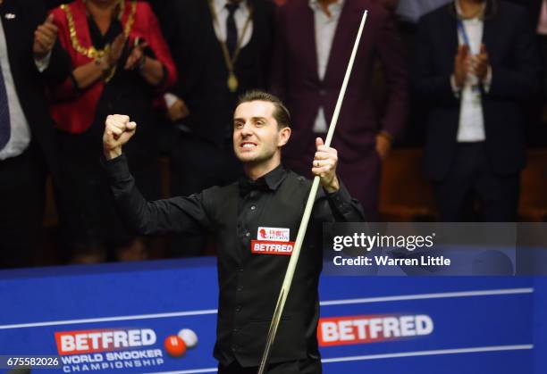 Mark Selby of England celebrates after beating John Higgins of Scotland in the final of the World Snooker Championship on day seventeen at Crucible...