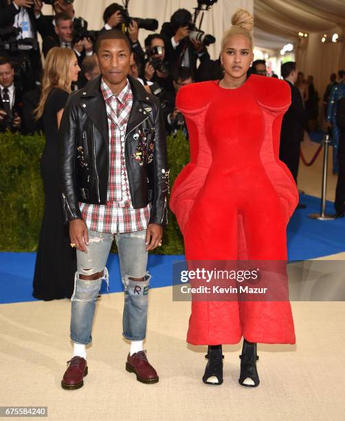 Pharrell Williams and Helen Lasichanh attend the "Rei Kawakubo/Comme des Garcons: Art Of The In-Between" Costume Institute Gala at Metropolitan...