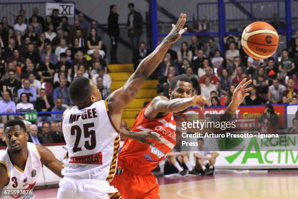Eric Maynor of Openjobmetis competes with Melvin Ejim and Tyrus McGee of Umana during the LegaBasket of Serie A1 match between Reyer Umana Venezia...