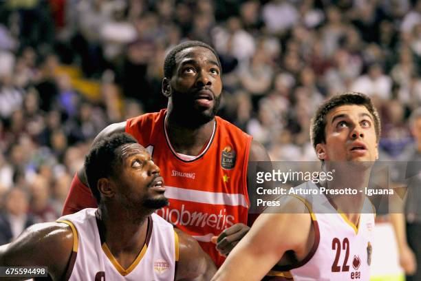 Anosike of Openjobmetis competes with Melvin Ejim and Jeff Viggiano of Umana during the LegaBasket of Serie A1 match between Reyer Umana Venezia and...
