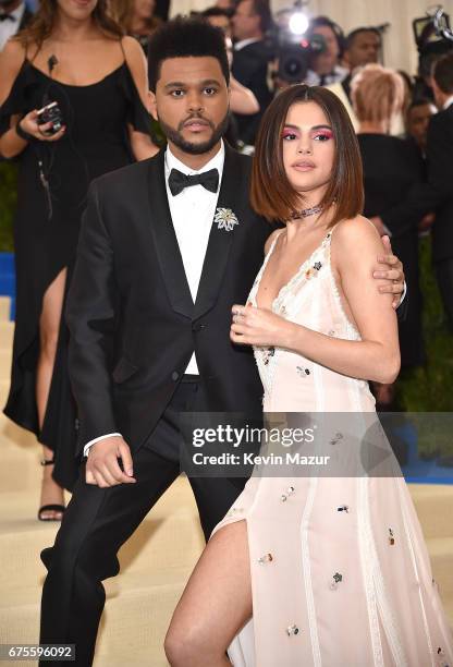 The Weeknd and Selena Gomez attend the "Rei Kawakubo/Comme des Garcons: Art Of The In-Between" Costume Institute Gala at Metropolitan Museum of Art...