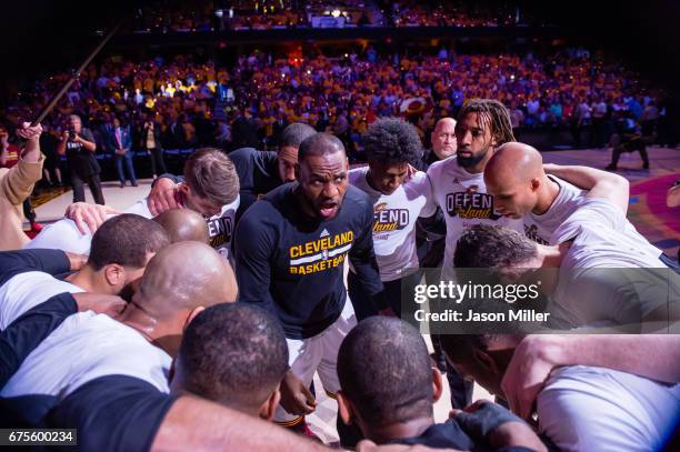LeBron James of the Cleveland Cavaliers leads his teammates in the huddle prior to Game One of the NBA Eastern Conference semifinals against the...