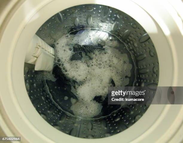 clothes in the washing machine - washing machine with bubbles stock pictures, royalty-free photos & images