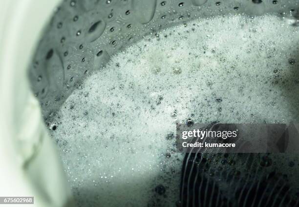 in a washing machine,close up - washing machine with bubbles stock pictures, royalty-free photos & images