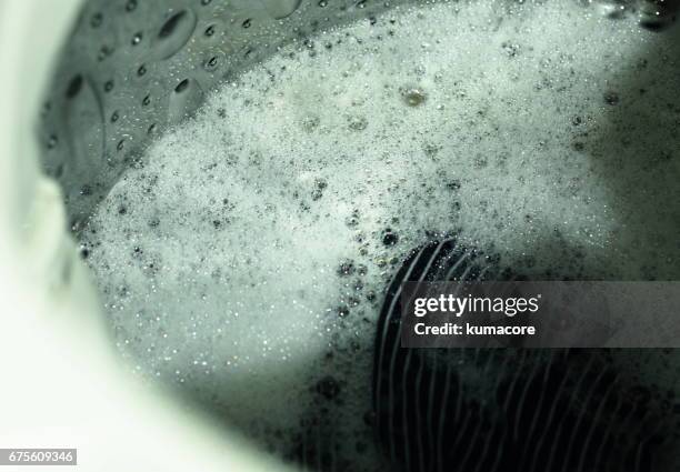 in a washing machine,close up - washing machine with bubbles stock pictures, royalty-free photos & images