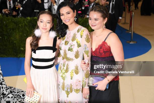 Wendi Deng Murdoch with her daughters Chloe Murdoch and Grace Helen Murdoch attends "Rei Kawakubo/Comme des Garcons: Art Of The In-Between" Costume...