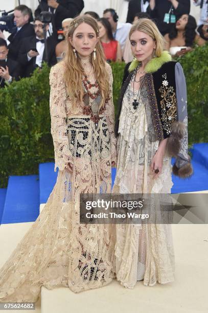 Mary-Kate Olsen and Ashley Olsen attend the "Rei Kawakubo/Comme des Garcons: Art Of The In-Between" Costume Institute Gala at Metropolitan Museum of...
