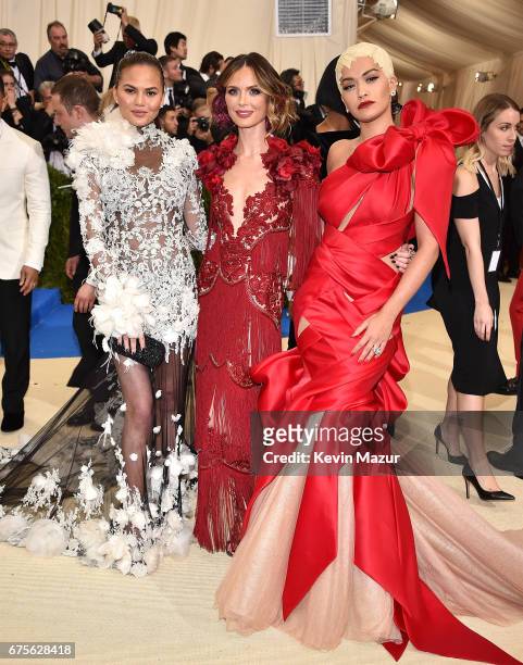 Chrissy Teigen, Georgina Chapman and Rita Ora attends the "Rei Kawakubo/Comme des Garcons: Art Of The In-Between" Costume Institute Gala at...