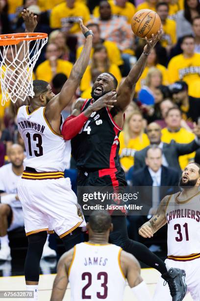 Tristan Thompson of the Cleveland Cavaliers tries to block Patrick Patterson of the Toronto Raptors during the second half of Game One of the NBA...