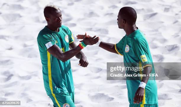 Ibrahima Balde of Senegal celebrates a goal with team mate Ibra Thioune during the FIFA Beach Soccer World Cup Bahamas 2017 group A match between...