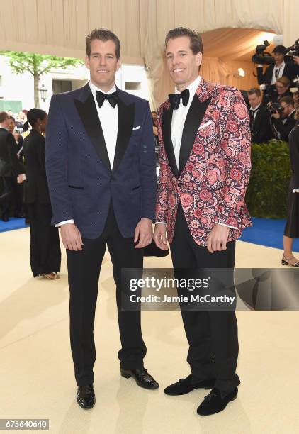 Tyler Winkelvoss and Cameron Winkelvoss attend the "Rei Kawakubo/Comme des Garcons: Art Of The In-Between" Costume Institute Gala at Metropolitan...