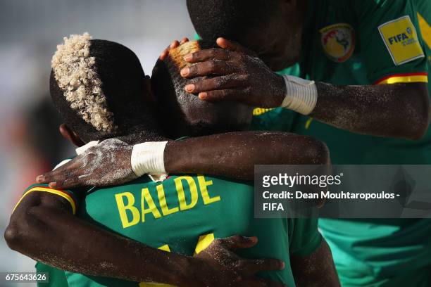 Mamour Diagne of Senegal celebrates scoring a goal with Ibrahima Balde during the FIFA Beach Soccer World Cup Bahamas 2017 group A match between...