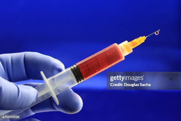 health worker prepares a vaccine - tetanus stock pictures, royalty-free photos & images